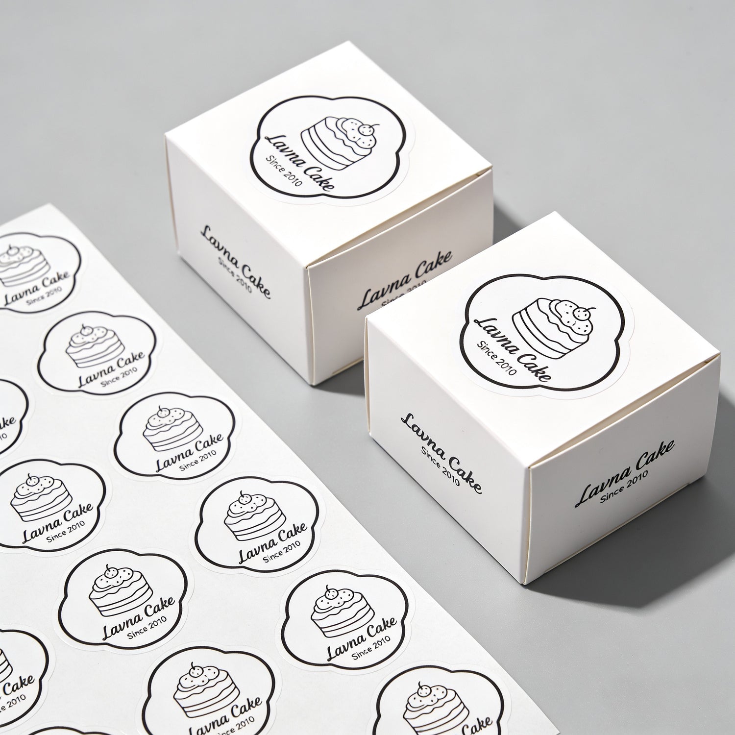 die cut sheet labels for bakery packaging with custom logo stickers on cake boxes