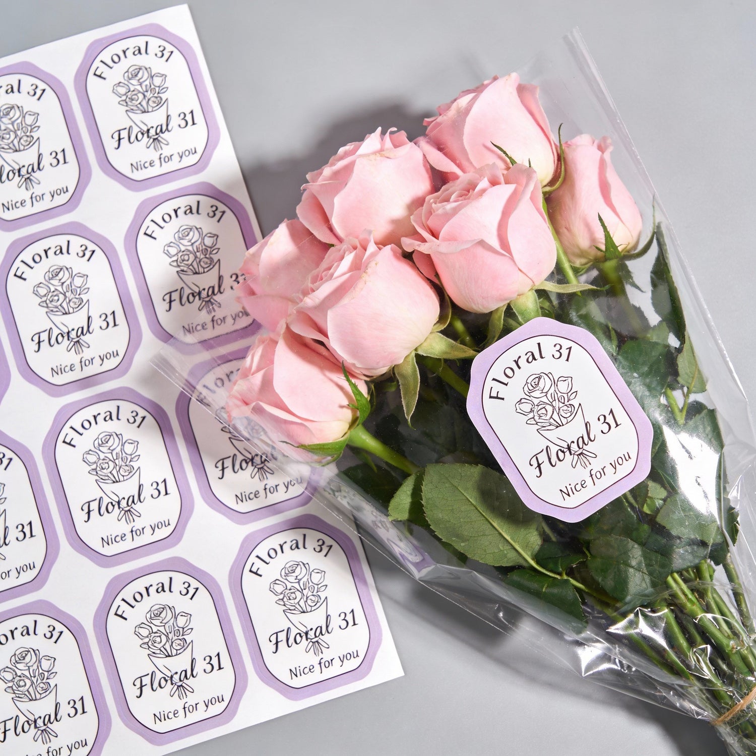 Bouquet of pink roses with 'Floral 31' custom die cut sheet labels with unique shapes for branding, packaging, and product labeling