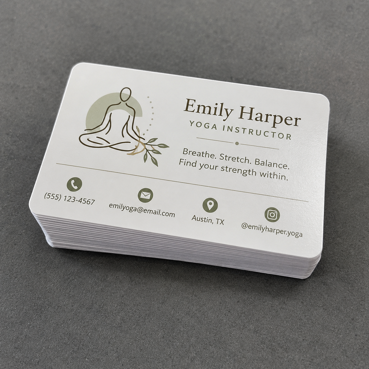 A neat thick stack of premium rectangle matte vinyl business card stickers with rounded corners, cleanly displayed on a dark grey textured studio surface.
