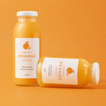 Custom waterproof labels for packaging featuring a freshly squeezed orange juice design on glass bottles with an orange background.