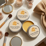 Honey lip balm with personalized lip balm labels​ on a light surface with makeup tools.