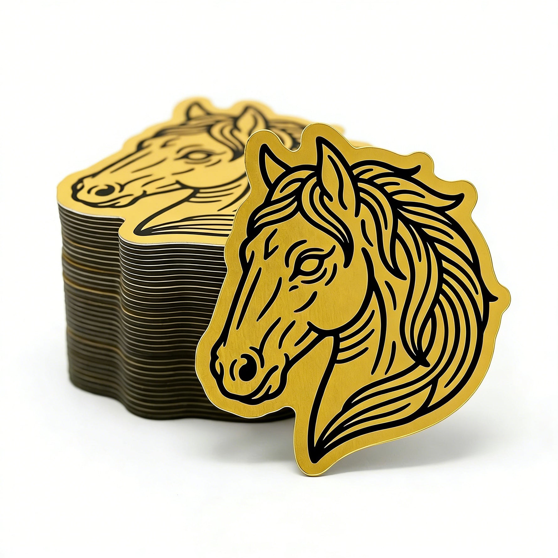 Stack of gold horse stickers on a white background