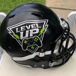 Level Up gaming vinyl decal with controller and lightning bolt graphics on a matte black football helmet.