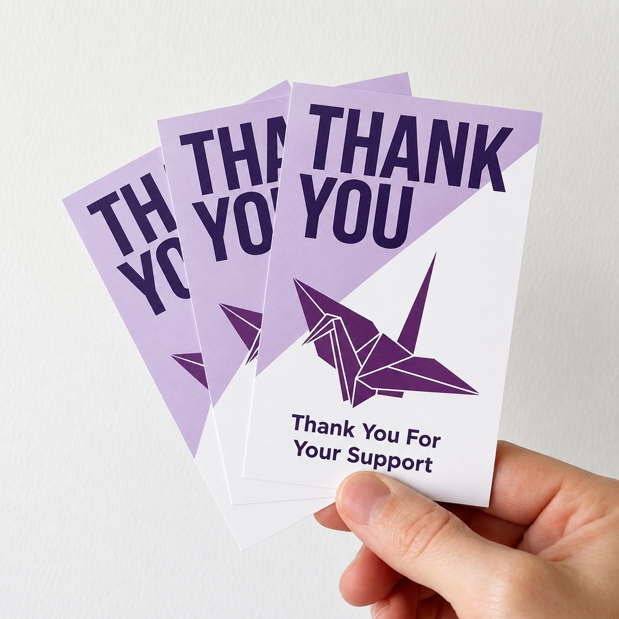 Professional matte stickers used for product branding on "Thank You For Your Support" cards, featuring a purple origami crane design and clean minimalist typography.