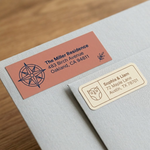 Modern personalized mailing labels with compass and owl icons in earthy terracotta and cream tones.