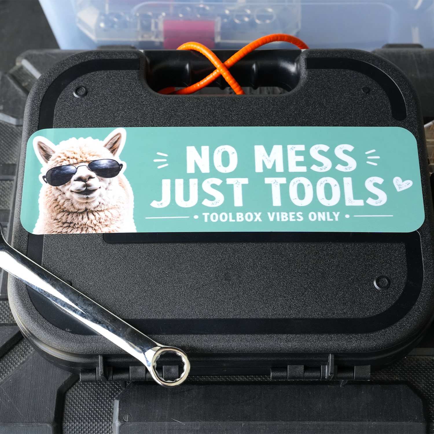 Teal custom bumper sticker featuring an alpaca with sunglasses and NO MESS JUST TOOLS on a toolbox.