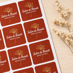 Orange rounded corner sheet labels for salon branding, custom printed beauty stickers arranged on label sheets
