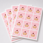 Pink square sheet labels with dessert branding stacked in multiple label sheets
