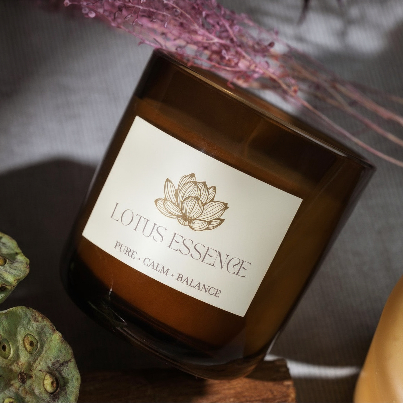 Custom vinyl rectangle stickers with gold lotus design and "Lotus Essence" text, perfect for amber glass candle jars and aromatherapy containers