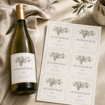 A sheet of six printable Sauvignon Blanc wine labels next to a finished bottle, featuring vintage grape sketches and Marlborough New Zealand branding.