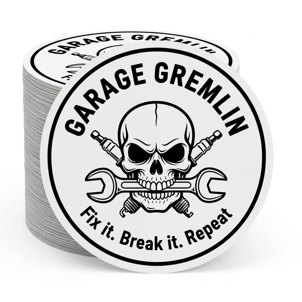 Stack of metallic Sticker with skull and crossed wrenches design, featuring 'Garage Gremlin' text.