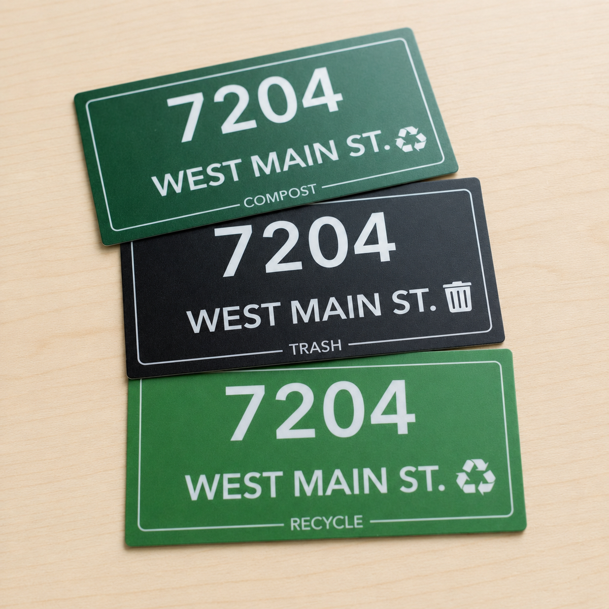 Set of custom trash can stickers with house number for compost, trash, and recycle bins in green and black