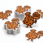 Bulk brown cartoon die-cut stickers arranged in small stacked piles.
